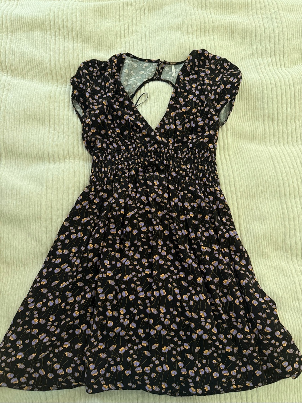 Free People black floral smocked dress in size Small 🖤💜🧡
